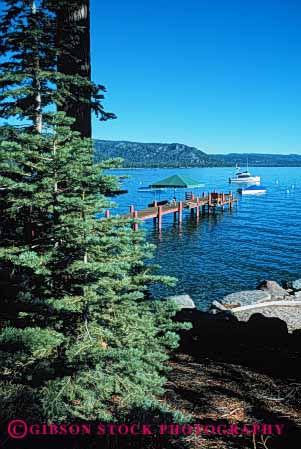 Stock Photo #4910: keywords -  boat california calm dock fir forest lake landscape mountain mountains scenic shore tahoe tree vert water wood