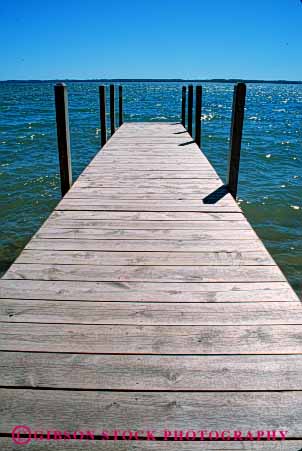 Stock Photo #4911: keywords - boat calm dock horizon lake landscape michigan parallel pattern scenic shore vert water wood
