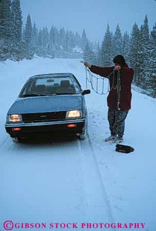 Stock Photo #4944: keywords -  alone auto automobile bad break breakdown broke broken cars chain chairs challenge dark delay distressed down dusk evening frustrate frustrated frustrating frustration highway inconvenience inconvenient install isolated mechanical motorist nervous people person problem quit released remote repair road roadside scared snow stall stalled stop stopped storm strand stranded street stuck tire tires trouble vehicle vert weather winter woman