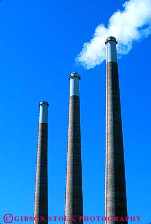 Stock Photo #4977: keywords -  air aviation cylinder cylindrical discharge emission exhaust factory hazard hollow industrial industry parallel pollution quality round smoke stacks steam tall three tube vert