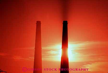 Stock Photo #4981: keywords -  air aviation cylinder cylindrical dawn discharge dusk emission exhaust factory hazard hollow horz industrial industry orange pollution quality round silhouette smoke stacks sunrise sunset tall tube two