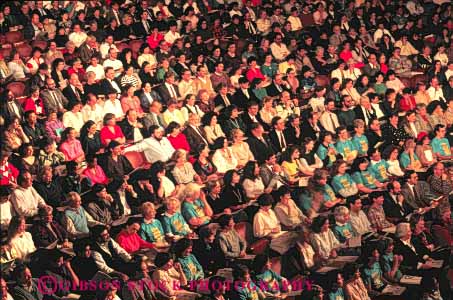 Stock Photo #4986: keywords -  array audience concert crowd crowded gather gathered gathering grouped horz indoor lots many multitude observe pattern people performance row seated seating see together watch