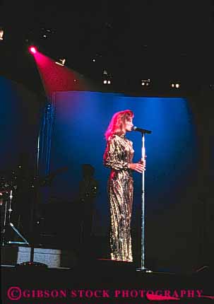 Stock Photo #5038: keywords - act acting actress art costume display drama dramatic microphone perform performance performers performing production show sing singer skill solo spotlight stage vert visual woman