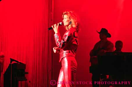 Stock Photo #5039: keywords - act acting actress art costume display drama dramatic horz microphone perform performance performers performing production show sing singer singing skill solo stage visual woman