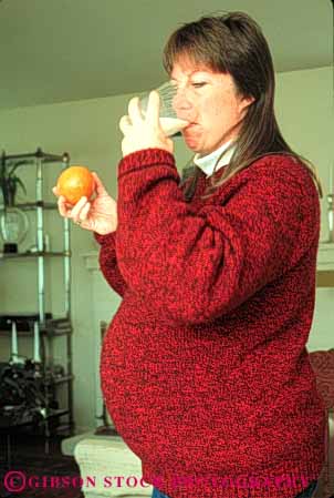 Stock Photo #5042: keywords -  baby drink drinking eat milk mother motherhood nutrition orange pregnant released vert wife woman
