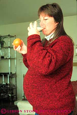 Stock Photo #5042: keywords - baby drink drinking eat milk mother motherhood nutrition orange pregnant released vert wife woman