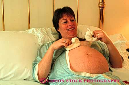 Stock Photo #5045: keywords -  bed bedroom home horz in mother motherhood pregnant privacy private released wife woman