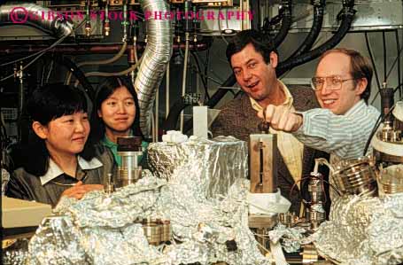 Stock Photo #5055: keywords -  aluminum asian chinese equipment ethnic foil four gender high horz in industry laboratory machine mechanical mixed research researchers researching science scientists team technical technology