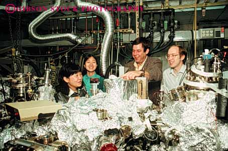Stock Photo #5056: keywords -  aluminum asian chinese equipment ethnic foil four gender high horz in industry laboratory machine mechanical mixed research researchers researching science scientists team technical technology