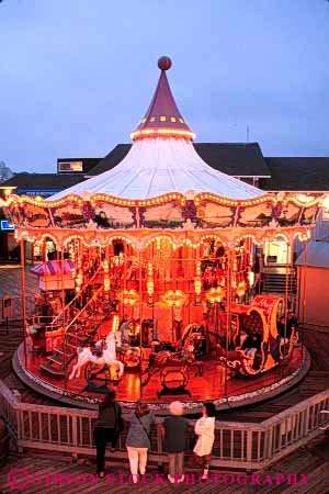 Stock Photo #5111: keywords -  action amusement around blur blurred carousel child children circle circular dusk dynamic francisco fun lighting merry motion move movement moving nine park pier ride round san sunset thirty thrill vert