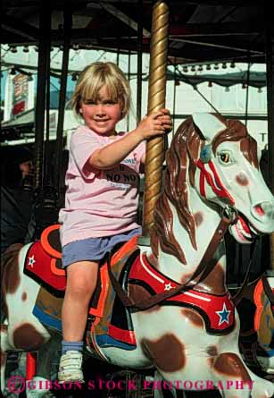Stock Photo #5112: keywords -  amusement around carousel child children circle circular fair fun girl horse merry park released ride round smile thrill vert