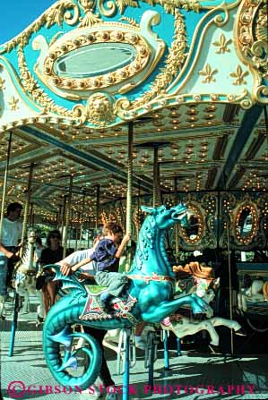 Stock Photo #5113: keywords -  amusement around blue boy carousel child children circle circular fair fun horse merry park ride round thrill vert