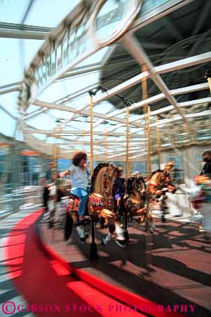 Stock Photo #5115: keywords -  action amusement around blur blurred carousel circle circular fun merry motion move movement park ride round thrill vert woman