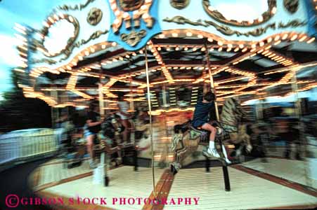 Stock Photo #5116: keywords -  action amusement around blur blurred boy carousel child children circle circular fun horz merry motion move movement park ride round thrill
