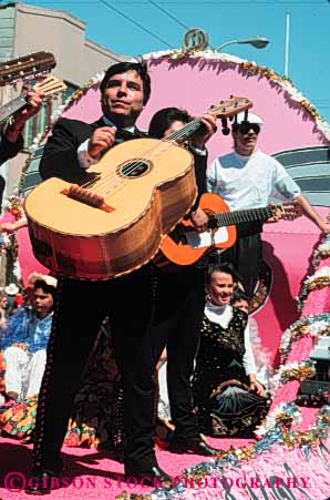 Stock Photo #5130: keywords -  annual celebrate celebrating celebration cinco color colorful costume costumed de decent display ethnic event festival float francisco guitar heritage hispanic holiday man mayo men mexican mexico minority music musicians national nationality parade perform performance performers san share show together united unity vert