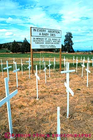 Stock Photo #5138: keywords - abortion array baby birth controversial controversy cross dead death debatable debate demand demonstrate demonstration die expression grave idea issue kill killing kills many object opinion position protect sign social society statement vert white