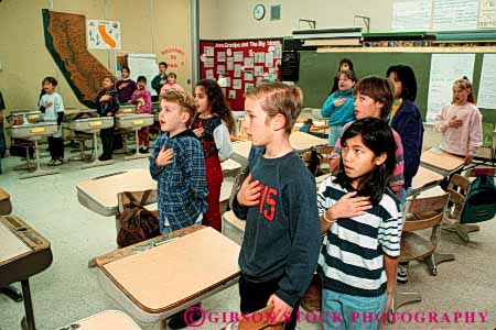 Stock Photo #5162: keywords -  allegiance america american americana and blue boy boys children citizen class classroom country dedicate dedicated ethnic forth fourth gender girl girls grade group hand horz mixed nation national nationality oath of old patriotic pledge red repeat ritual say school share speak states symbol symbolic together unison united white year