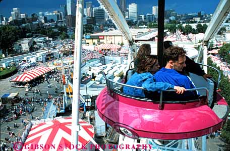 Stock Photo #5167: keywords -  amusement calgary couple elevate elevated fair ferris festival fun horz park play ride stampede summer teenager teenagers teens thrill wheel