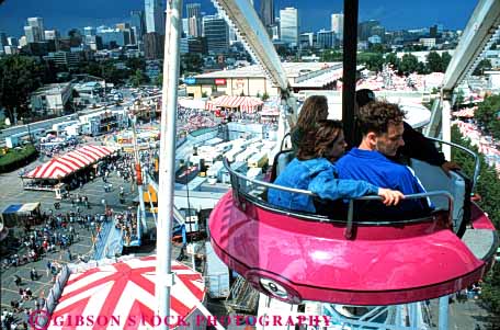 Stock Photo #5167: keywords - amusement calgary couple elevate elevated fair ferris festival fun horz park play ride stampede summer teenager teenagers teens thrill wheel