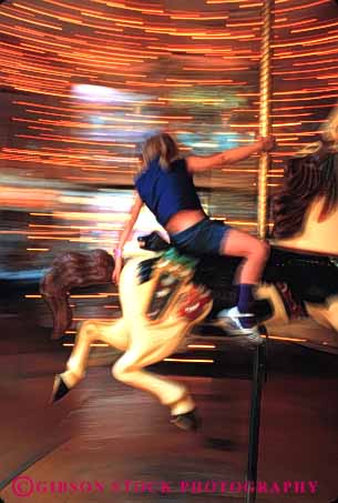 Stock Photo #5172: keywords -  amusement blur carousel dynamic fair festival fun girl merry motion move movement moving park play ride round summer thrill vert