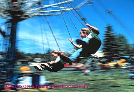 Stock Photo #5176: keywords -  amusement centrifugal circle circular fair festival force fun girls horz motion park play released ride rotate spin summer swing thrill