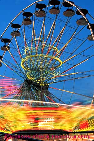Stock Photo #5186: keywords - amusement blur dusk fair festival fun light lighting lights motion movement moving park play rides summer thrill vert