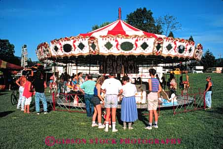 Stock Photo #5192: keywords -  activity amusement attraction carnival carnivals carousel carousels color colorful event fair fairs families family festival festivals fun grants horz merry mobile oregon park pass people person play portable recreation ride rides round summer temporary thrill