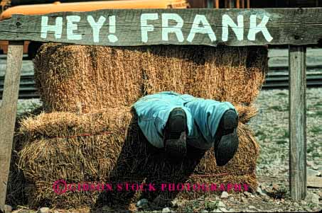 Stock Photo #5223: keywords - bale bales boots cute different fun funny hay horz humor humorous imitation in leg legs man peculiar strange stuck