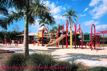 Stock Photo #5227: keywords - childhood clean climb climbing color colorful geometric geometry ground horz metal new palm plastic play playground safe sand shape shapes toy tree trees tropical