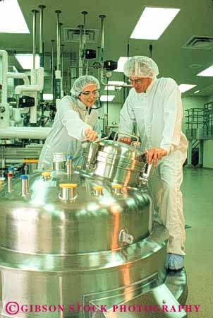 Stock Photo #5240: keywords - bio-medical bio-medicine biochem biochemical biochemistry bioengineer bioengineering bioengineers biomedical bioscience career chemical chemicals chemistry clean cleanroom cooperate equipment exact extract genetech high industry job lab laboratory man manufacture manufacturing medical metal molecular occupation organic precise precision released research room sanitary science share solution stainless steel sterile suit tank team tech technical technician technicians technology together vert vocation woman work worker working