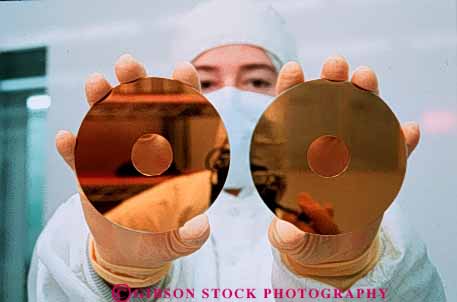 Stock Photo #3418: keywords -  clean communications disk disks drive high holding horz in industry manufacturing room round sanitary technician technology two woman
