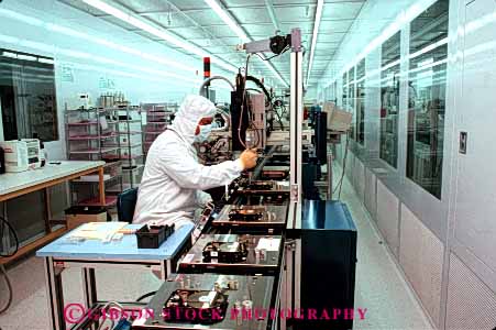 Stock Photo #5279: keywords -  assemble assembling assembly career clean cleanroom computer disk drive electric electrical electricity electronic electronics employee equipment exact hard high horz industry job manufacture manufacturing memory occupation precise precitsion quantum research room science tech technical technician technology vocation work worker