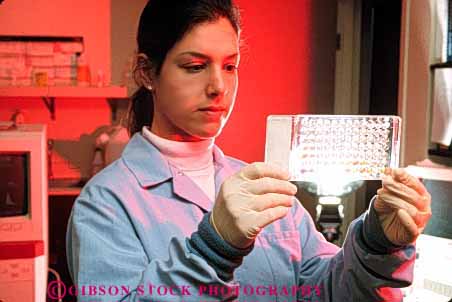 Stock Photo #5289: keywords - blood career compare examine gloves health horz hospital job lab labor laboratories laboratory latex medical medicine occupation protection released research review study technical technician technicians test tested tester testing transparent vocation woman work worker working