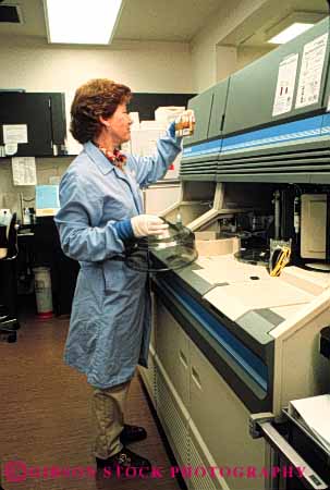 Stock Photo #5293: keywords - career coat compare examine gloves health hospital job lab labor laboratories laboratory latex medical medicine occupation protection released research review study technical technician technicians test tested tester testing transparent tubes vert vocation woman work worker working