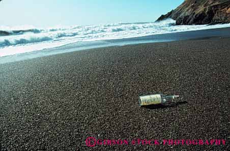 Stock Photo #5321: keywords -  beach bottle coast communicate communicating communication drift emergency float glass help horz in lost message ocean paper rescue sea shore strand stranded survivor water word write