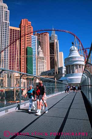 Stock Photo #5331: keywords -  across casino city cross elevated las move new pavement pedestrians people road silhouette step street vegas vert walk walker walking walkway york