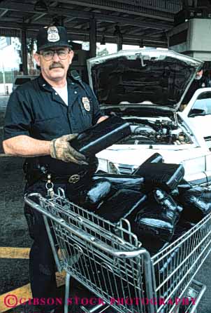 Stock Photo #5342: keywords - agent border bricks california contraband controversial controversy customs drug drugs enforcement government illegal import law marijuana mexico officer pot reefer san seize u.s. vert ysidro