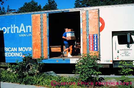 Stock Photo #5352: keywords -  boxes carry carrying door employee family home horz house household job labor lift move movement mover movers moving occupation pack package packed packing physical relocate relocating relocation strength strong transfer truck van vocation work worker working