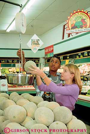 Stock Photo #13370: keywords - adolescent adolescents african american asian black boy boys buy buyer buyers buying cantaloupe children couple customer customers ethnic ethnicity fresh friend friends genders girl girls grocery in indoor indoors inside interior measure measurement measures measuring minorities minority mixed multi people produce race races released scale scales shop shopper shoppers shopping store stores teen teenage teenagers teens together two vert weigh weighing weighs weight young youth