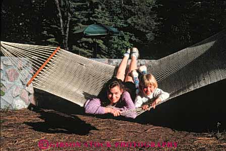 Stock Photo #5429: keywords -  adolescence adolescent adolescents adult children class field friend friends girls group hammock high horz interaction junior middle outdoor outdoors outside recreation school sisters social student students summer teen teenager teenagers teens trip two woman women young