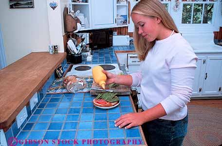 Stock Photo #12739: keywords - adolescent adolescents child children female food girl home horz in indoor indoors kitchen kitchens lunch make makes making meal meals released sandwich teen teenage teenager teenagers teens woman young youth