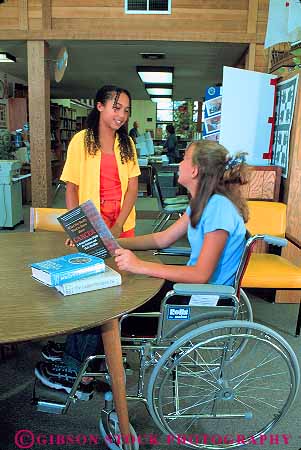 Stock Photo #12742: keywords -  adolescent adolescents african american black book books challenge challenged chat chatting child children disability disable disabled disadvantage disadvantaged ethnic friend friends girls handicap handicapped in libraries library minority mixed physical physically read reading released sit sits sitting social student students talk talking teen teenage teenager teenagers teens vert wheelchair wheelchairs young youth