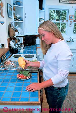 Stock Photo #13374: keywords - adolescent adolescents child children counter food girl girls home homes house in kitchen kitchens lunch make makes making people prepare prepares preparing released sandwich sandwiches teen teenage teenager teenagers teens vert young youth
