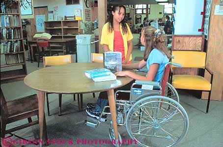 Stock Photo #13376: keywords -  adolescent adolescents african american black chair challenge challenged children disable disabled disadvantage disadvantaged ethnic ethnicity female friend friends gender girl girls handicap handicapped horz libraries library minority mix mixed multi need needs people physical physically read reading reads released special talk talking talks teen teenage teenager teenagers wheel wheelchair wheelchairs young youth