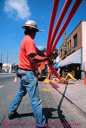 Stock Photo #5451: keywords -  angeles communication communications conduit downtown fiber install job labor laborer los occupation optic optics orange pipe plastic public road street technician technicians technology telecommunications tube under utilities utility vert work worker working