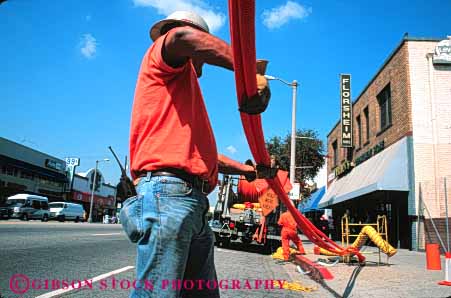 Stock Photo #5452: keywords -  angeles communication communications conduit downtown fiber horz install job labor laborer los occupation optic optics orange pipe plastic public road street technician technicians technology telecommunications tube under utilities utility work worker working