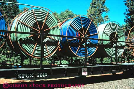 Stock Photo #5453: keywords -  carry circle circular communication communications conduit fiber horz optic optics pipe plastic public railroad roll rotate rotating round spool spools technology telecommunications tube utilities utility