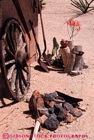Stock Photo #5459: keywords -  abandoned atmosphere desert dry equipment motif old shovel style vert wagon west western wheel yard