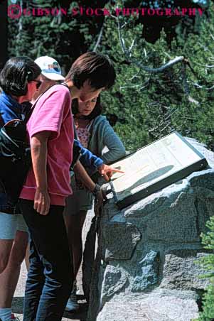 Stock Photo #5474: keywords -  asian crater display educate educating education ethnic exhibit group inform information informative informing interpret interpretive lake learn look minority national oregon park present read reading show vert view women